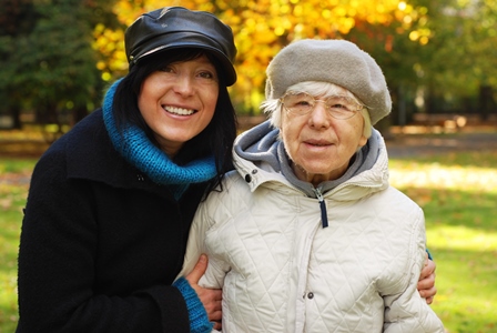 Young & Elder Woman Embracing Happily