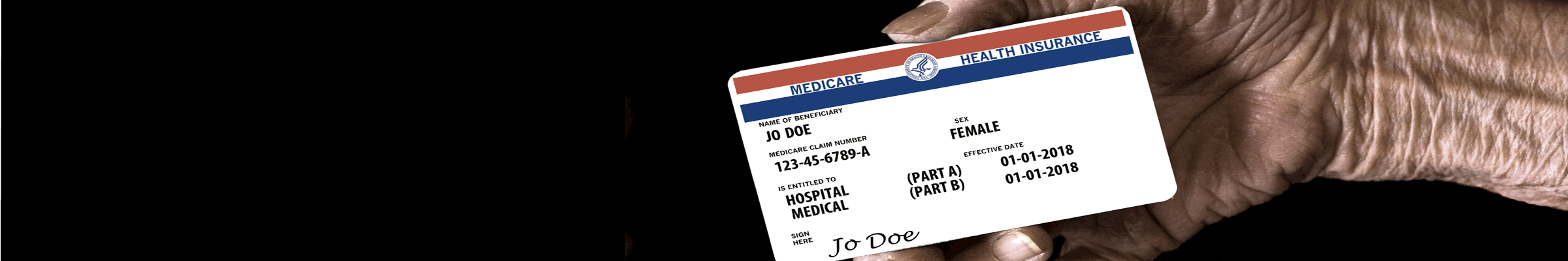 An elderly female hand holds a mock United States government Medicare Health Insurance card.