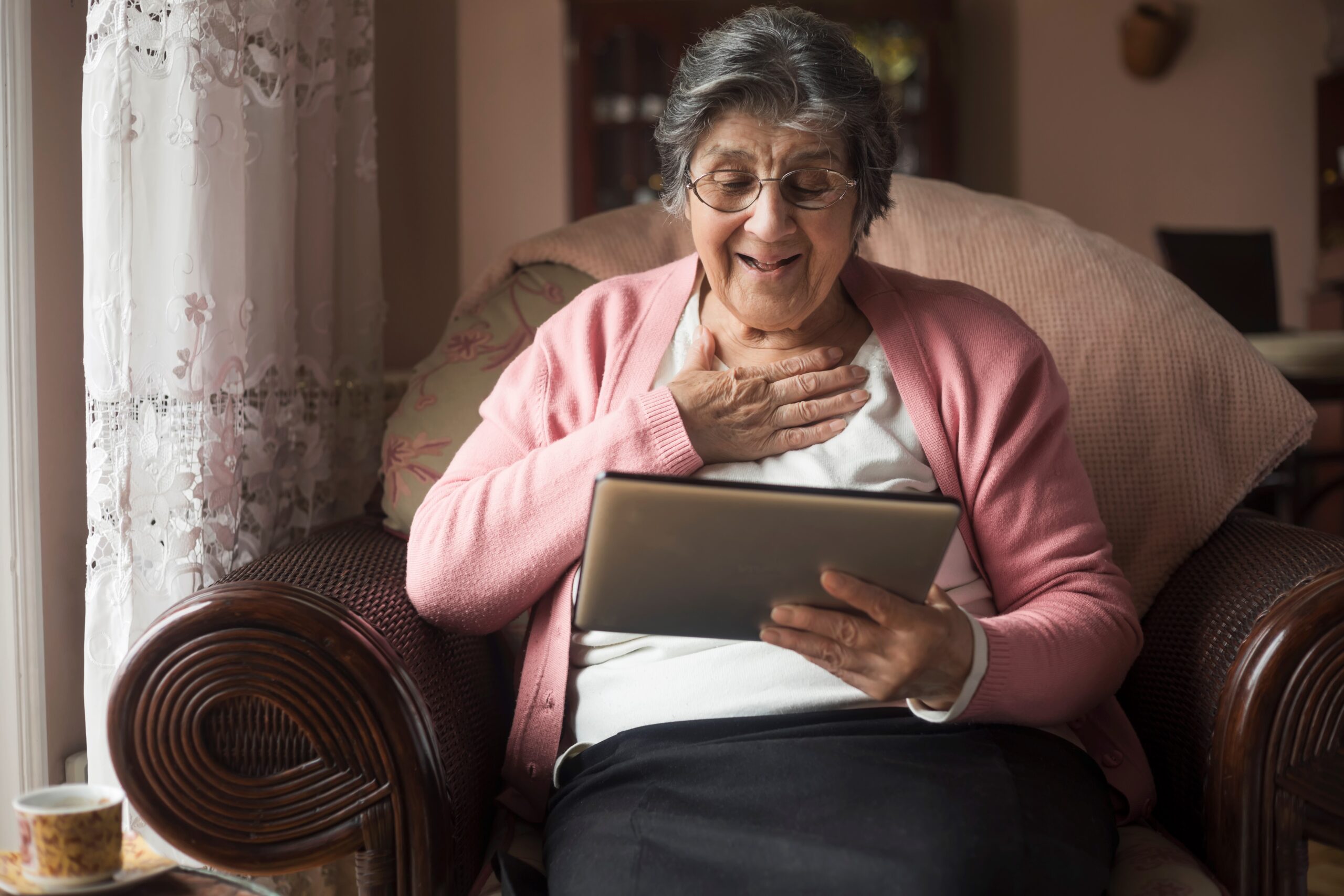 Senior woman enjoying at home and using modern technology